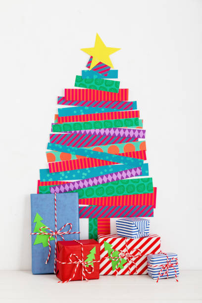 istock Christmas tree wall decoration and a gifts. 1069358742
