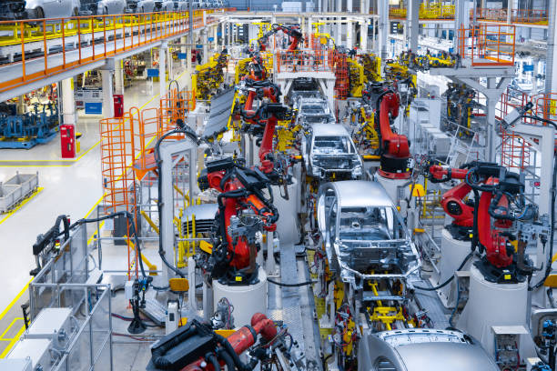 Automotive production line. Welding car body. Modern car Assembly plant Assembly line production of new car. Automated welding of car body on production line. robotic arm on car production line is working motor vehicle stock pictures, royalty-free photos & images