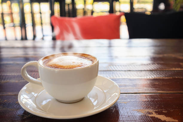 istock heart shape latte art in white coffee cup on wood table in cafe restaurant 1069362110