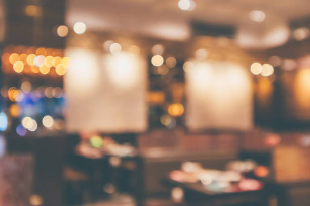 istock Restaurant cafe or coffee shop interior with customer blur abstract vintage style bokeh light for montage product display background 1069363176
