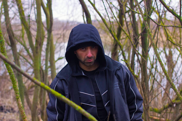 istock Handsome man in countryside landscape with lake and forest. 1069364848
