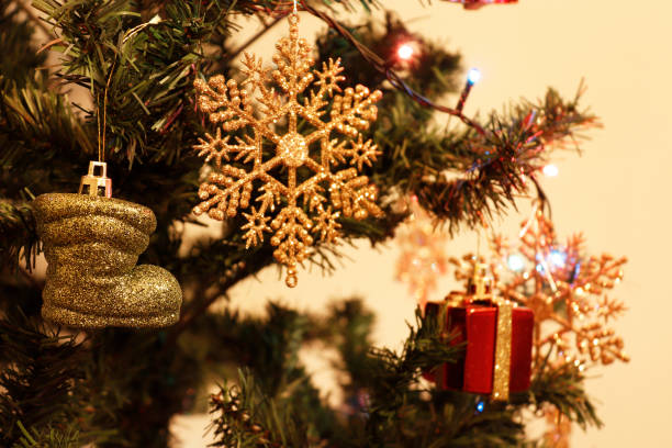 istock bright lights, christmas tree, tiny gifts, snowflake, christmas background 1069365402