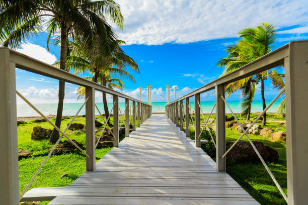 beautiful view on walkway, bridge leading to the tranquil inviting ocean and beach at Cuban Varadero island stock photo