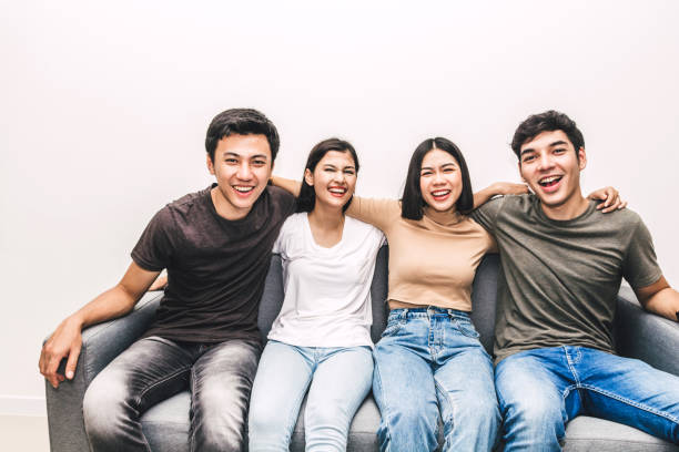 istock Group of happy friend sitting relax on sofa 1069368140