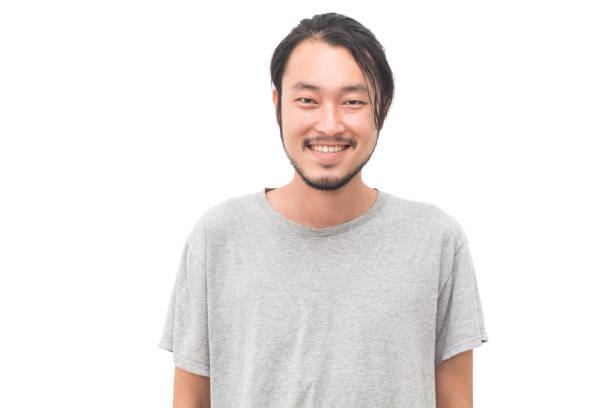 istock Portrait of a asian young handsome man smiling while standing isiolated on white background 1069368180