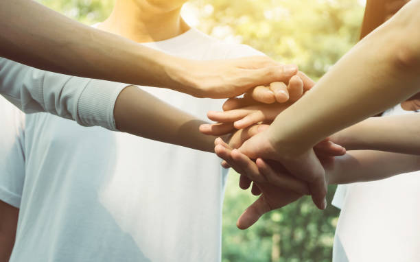 istock Team teamwork business join hand together concept, Power of volunteer charity work, Stack of people hand 1069371594
