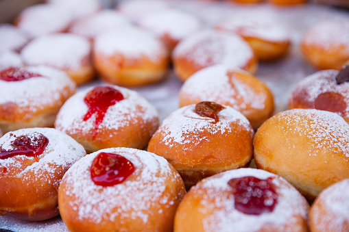 Hanukkah sufganiyot - doughnuts on a tray in the market