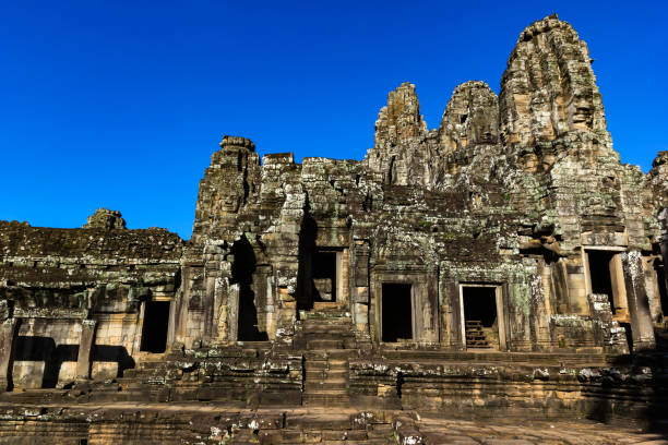istock Ruin stone Ancient Bayon Temple in Cambodia with blue sky 1069394812
