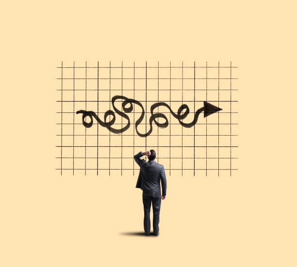 istock Businessman Looking Up At Chart Showing Unpredictable Moves 1069395444