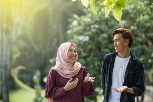 istock asian young friends chilling at park 1069408098