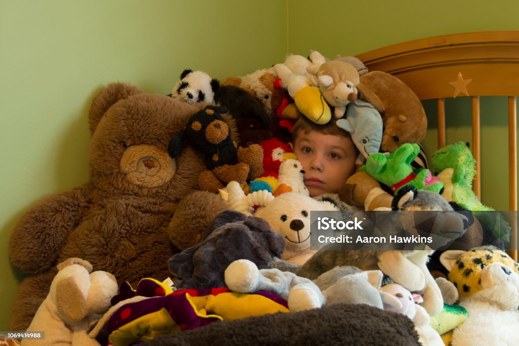 Hidden In A Pile Of Stuffed Animals Stock Photo - Download Image Now -  Child, Toy, Heap - iStock