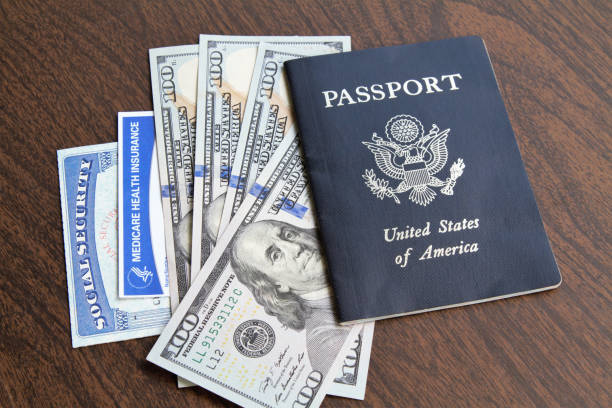 Medicare and Social Security cards with USA passport and currency Medicare and Social Security cards with USA Passport and currency. Health care and social welfare concept for seniors in the USA. Essential American ID's. social security social security card identity us currency stock pictures, royalty-free photos & images