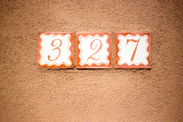 istock Ceramic Number 327 Street Address Tiles; Brown Wall 1069424964