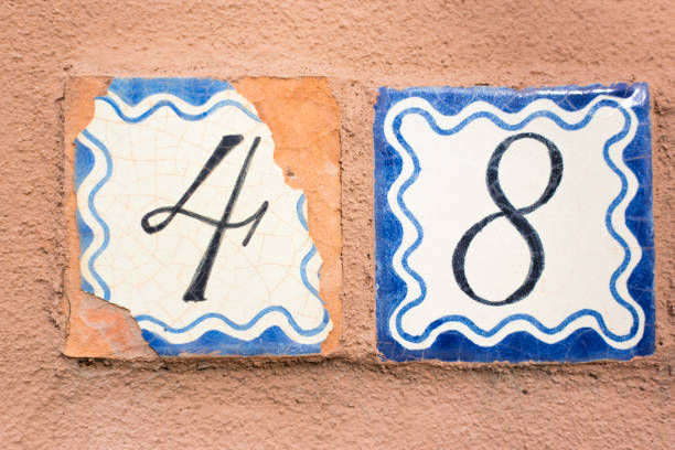 istock Ceramic Number 48 Street Address Tiles; Brown Wall 1069425128
