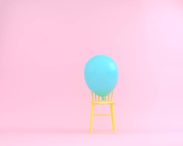 istock Balloon blue pastel with yellow chair on pink color background. Creative layout made for festival like birthday or christmas celebration party. minimal party concept idea. 1069427222