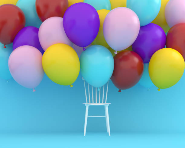 istock Colorful balloons floating with white chair on blue color background. Creative layout made for festival like birthday or christmas celebration party. minimal party concept idea. 1069427258