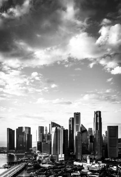 istock Singapore Skyline Abstract. Vertical Black and White Cityscape and Cloudscape. 1069431250