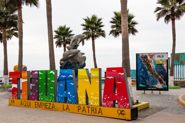 Giant Colorful Sign at Playas de Tijuana at the International Border Wall stock photo