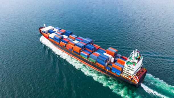 istock Aerial view cargo container ship sailing, container cargo ship in import export and business logistic and transportation of international by container ship in the open sea. 1069440444