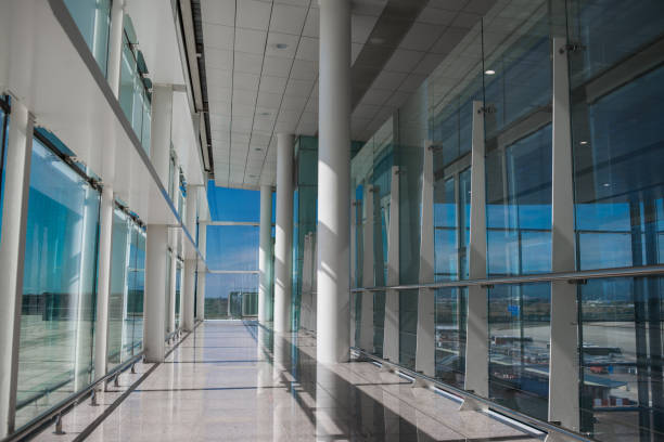 istock Empty Airport Hall with Glass Windows and White Column. Blue Sky. 1069440880