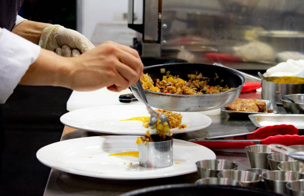 istock Chef preparing food, meal, in the kitchen, chef cooking, Chef decorating dish, closeup, Chef preparing food, meal, in the kitchen, chef cooking, Chef decorating dish, closeup, 1069442224