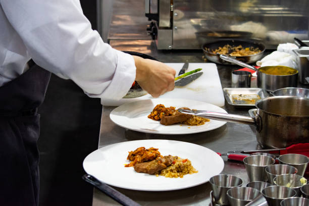 istock Chef preparing food, meal, in the kitchen, chef cooking, Chef decorating dish, closeup, Chef preparing food, meal, in the kitchen, chef cooking, Chef decorating dish, closeup, 1069442326