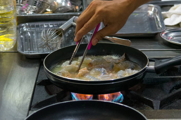 istock Chef preparing food, meal, in the kitchen, chef cooking, Chef decorating dish, closeup, Chef preparing food, meal, in the kitchen, chef cooking, Chef decorating dish, closeup, 1069442398