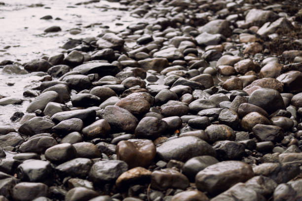 istock pebble stones by the sea. 1069442848