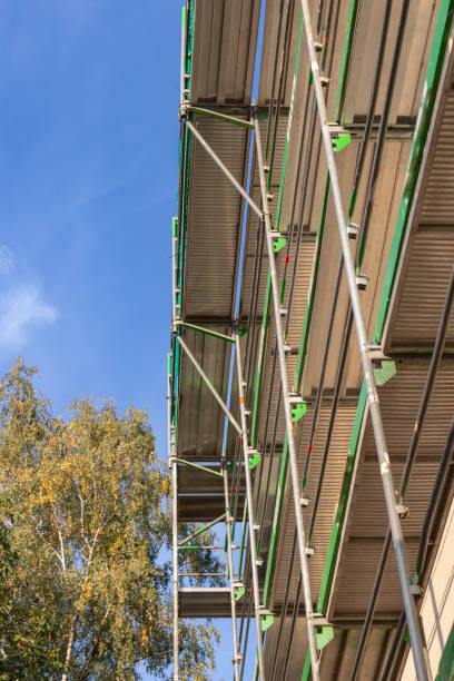 istock scaffolding at building on autumn sunshine afternoon 1069445378