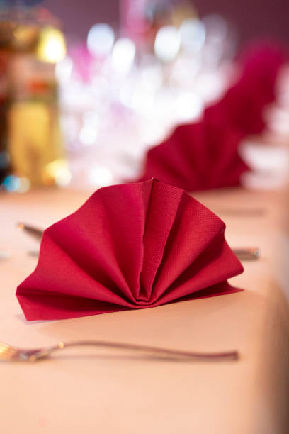 istock Hotel table decoration and arrangement - red napkins in a row 1069447936