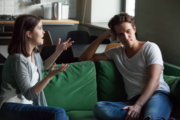 istock Young couple talking about their relations at home 1069463198