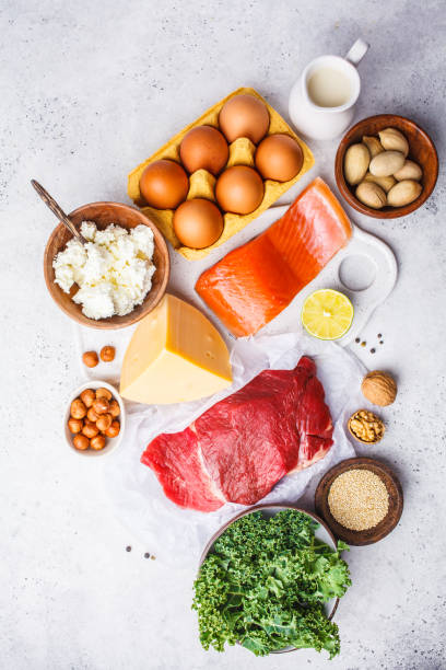 istock Balanced diet food background. Protein foods: fish, meat, eggs, cheese, quinoa, nuts on white background. 1069471430