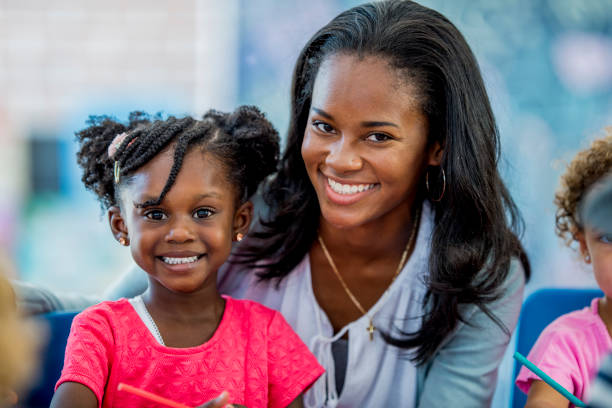 istock Daycare teacher and child 1069474010