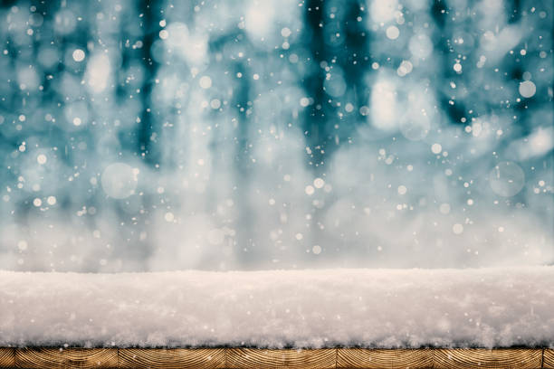 istock winter Christmas background with snow on the wood 1069475626
