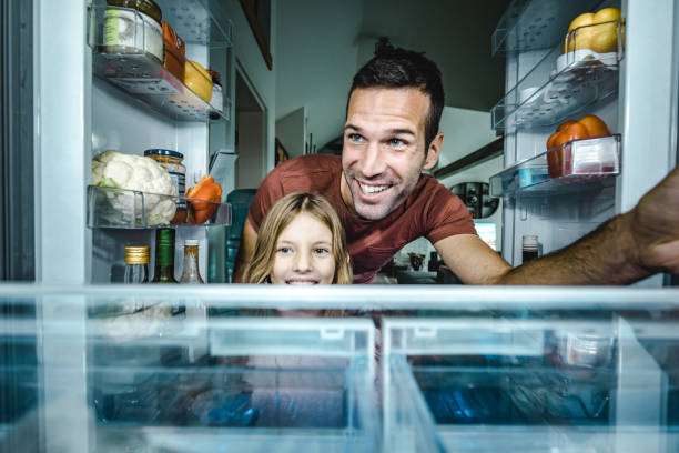 istock Sweetie, let's pick something to eat from a fridge! 1069476060