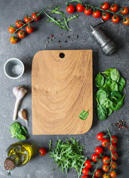 istock Cherry, basil, spice and olive oil on dark table. Copy space 1069478314