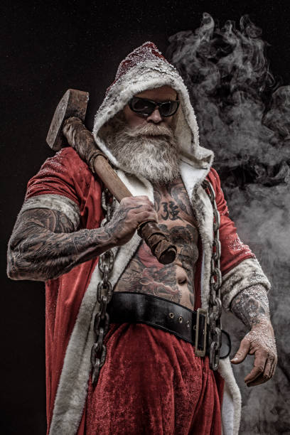 istock Bad Santa Claus with sledgehammer 1069479104
