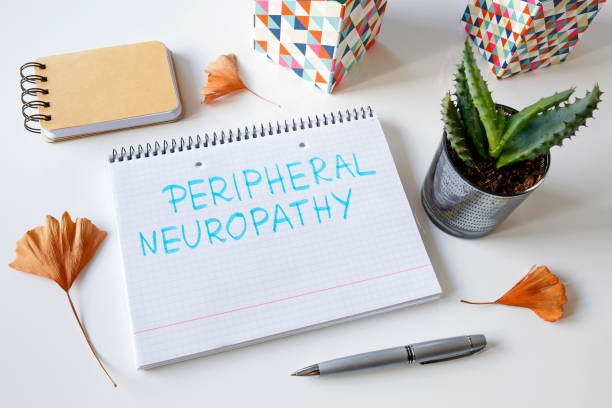 peripheral neuropathy written in a notebook stock photo