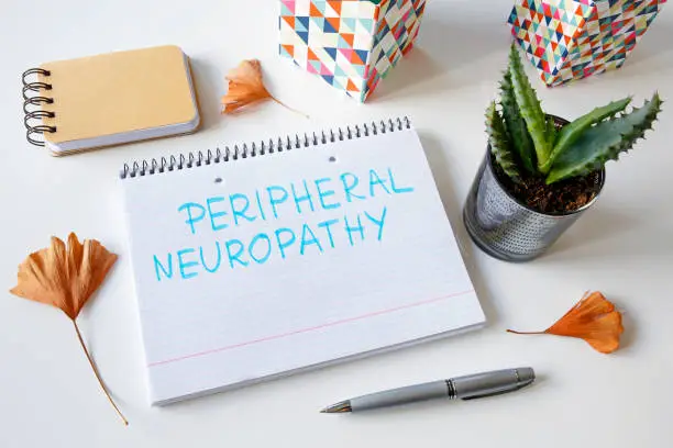 Photo of peripheral neuropathy written in a notebook