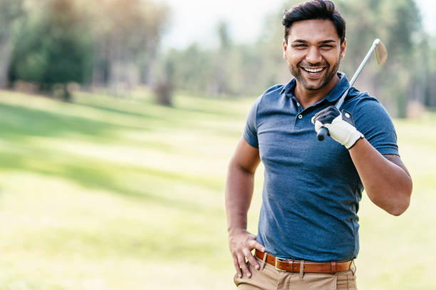 istock Cheerful golf player holding a golf club 1069488314