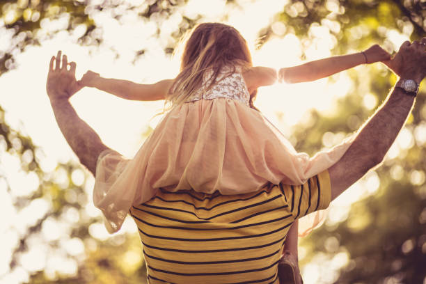 istock Raising her to reach for the sky. 1069490330