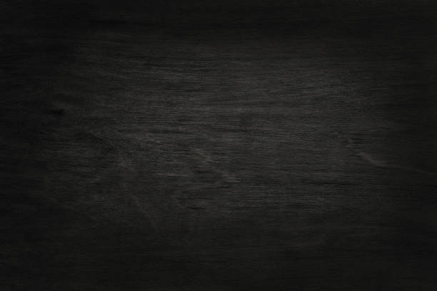 istock Black wooden wall background, texture of dark bark wood with old natural pattern for design art work, top view of grain timber. 1069493048