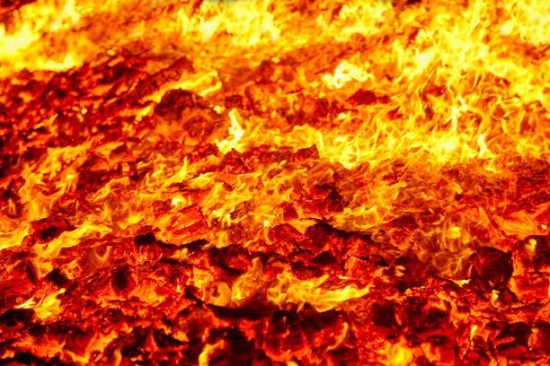 istock Fire. Volcano incandescent material. Hot charcoal bonfire. Carbon emissions 1069497282