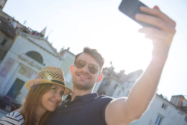 istock Friends taking selfie with smart phone 1069500704