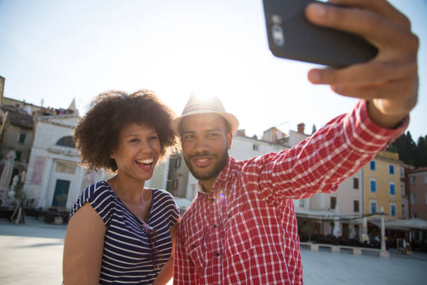 istock Man and woman taking selfie 1069500710