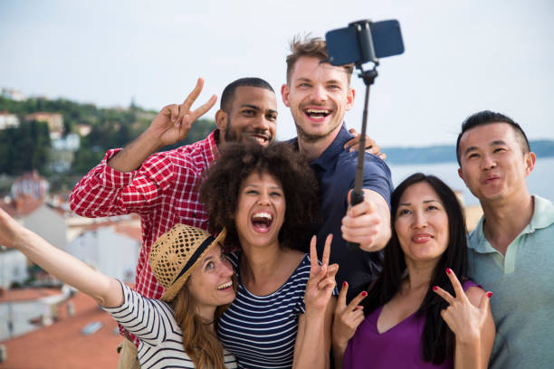 istock Friends taking selfie with smart phone 1069500950