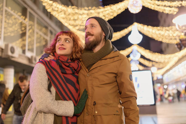 istock Young casual couple hugging and walking 1069500962