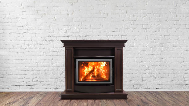 istock Fireplace on white brick wall in bright empty living room interior of house 1069501016