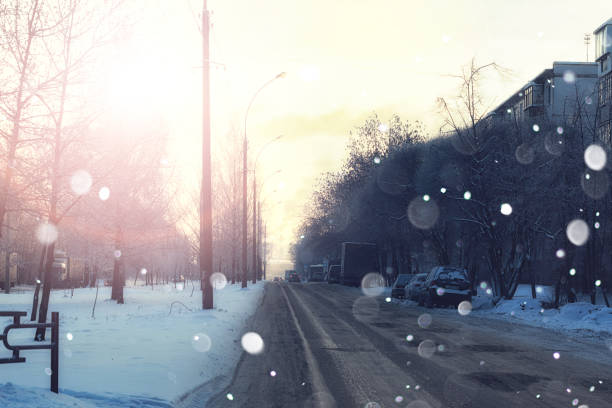 istock road city with car in winter sunset 1069502846