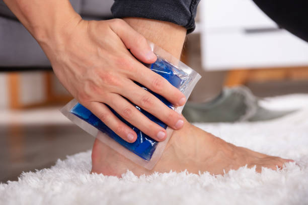 istock Man Applying Ice Gel Pack On An Ankle 1069502860